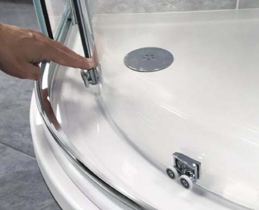 Quick release rollers make cleaning the shower door easy.
