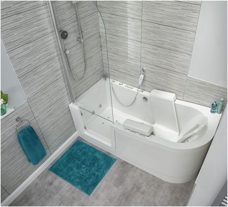 The Easy Riser walk in bath shown here as a 'corner' model with the optional hinged glass shower screen. Note how the bath installs square to the wall at both ends.
