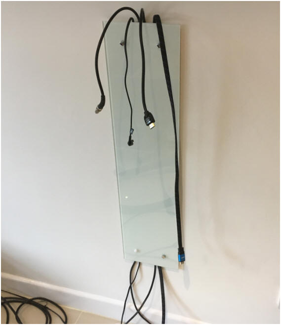 The Mirage TV cable cloaking panel during installation.