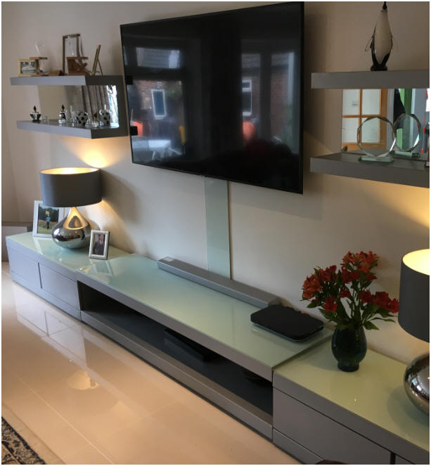 Once fully installed, cables to and from your wall mounted television are concealed behind a tasteful glass panel.