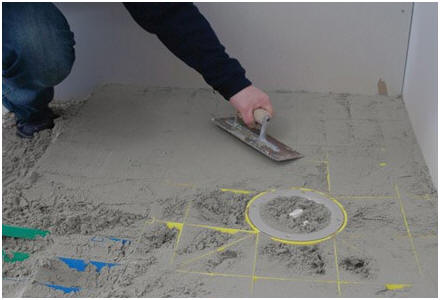 AQUAGRADE trowelling guide for a screed wet room shower floor